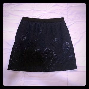 Black shinny, shimmering mini skirt from Loft.